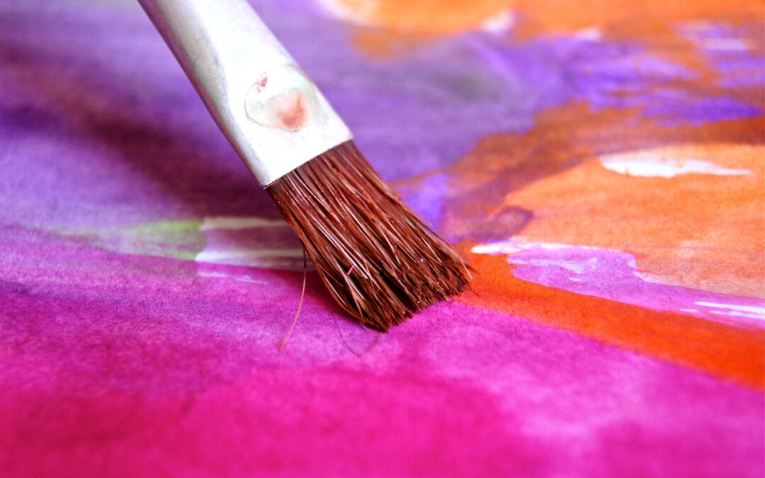 paintbrush and colorful canvas