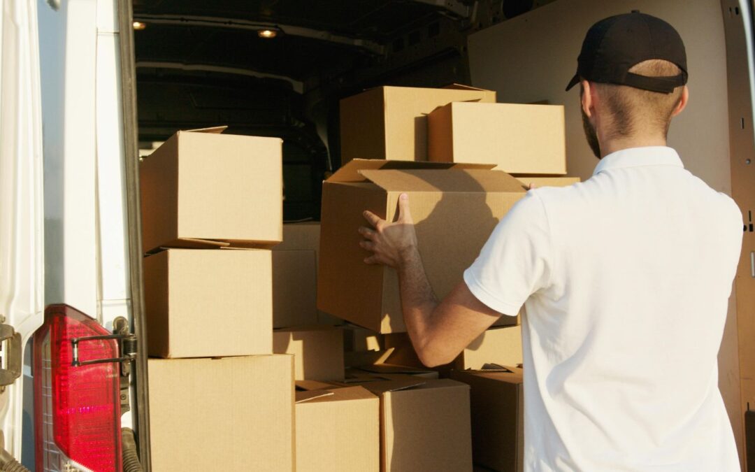 Man Loading Boxes Into A Truck